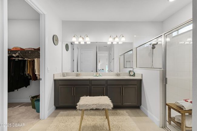 Primary Bathroom with Dual Sinks, Dual Walk-in Closets, and much more | Image 23