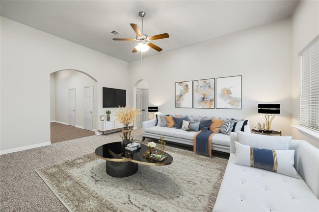 Stylish and functional living room with soaring ceilings, abundant natural light, and a modern layout ideal for relaxing or hosting guests. *Virtually Staged | Image 6