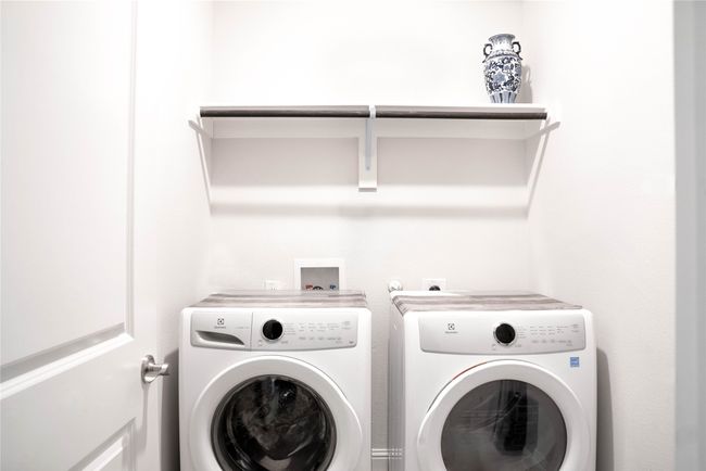 Laundry room with washing machine and dryer and laundry area | Image 10