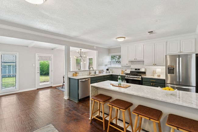 Looking towards the back porch and the full size laundry closet. | Image 12