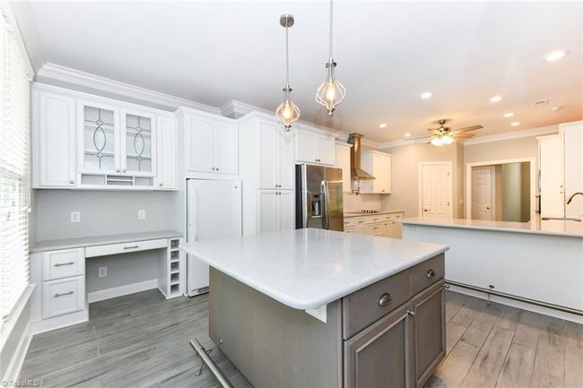Enjoy your custom meal planning work space and a built in freezer | Image 10