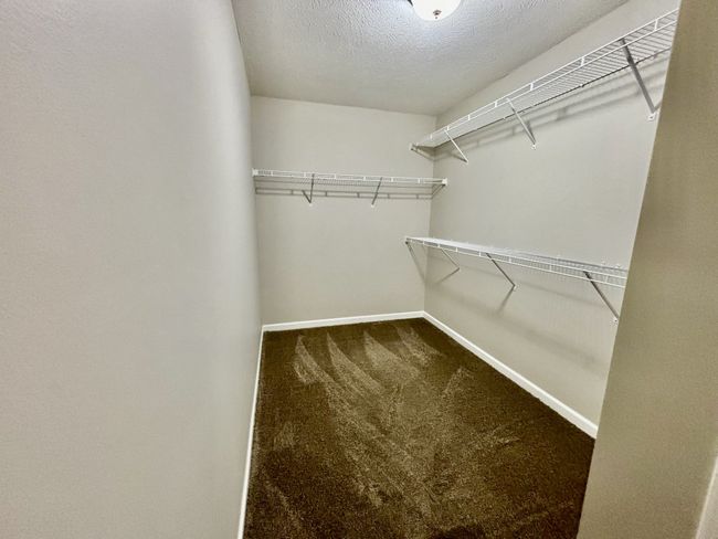 Walk in closet in Primary Bedroom is large | Image 11