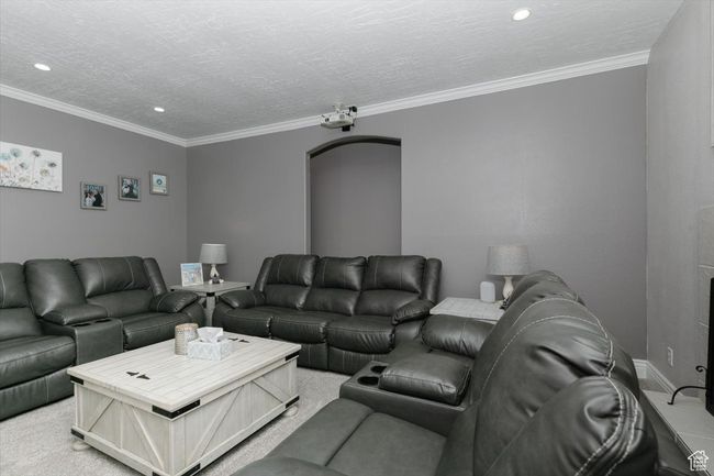 Living area with crown molding, light carpet, and recessed lighting | Image 5