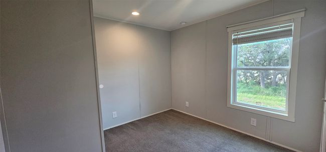 Carpeted empty room featuring baseboards and recessed lighting | Image 7