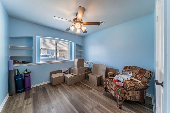 Living area featuring wood finished floors, ceiling fan, and baseboards | Image 21