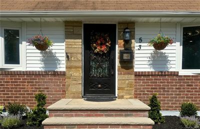 Entrance to property featuring covered porch | Image 2