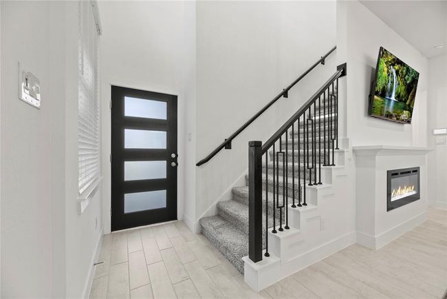 Another view of the front entry. Beautiful wrought iron staircase. | Image 5