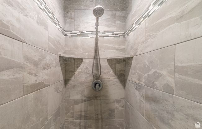 Bathroom view of tiled shower | Image 9