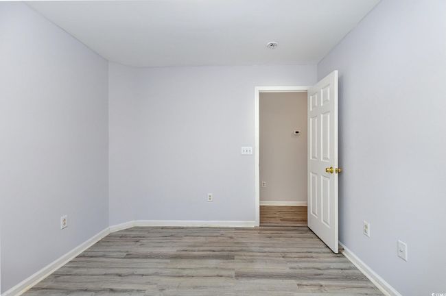 Unfurnished room featuring light wood-style floors and baseboards | Image 22