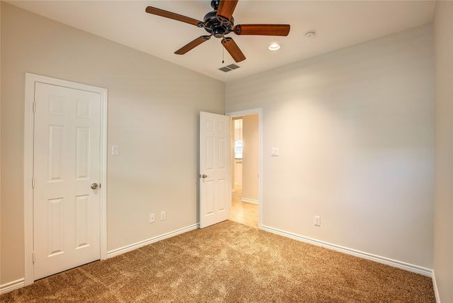 Unfurnished bedroom with carpet floors, recessed lighting, and ceiling fan | Image 27