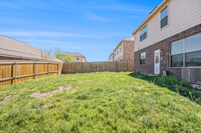 View of yard with a fenced backyard and central AC | Image 26