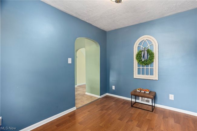 Wood floored empty room featuring a textured ceiling | Image 15
