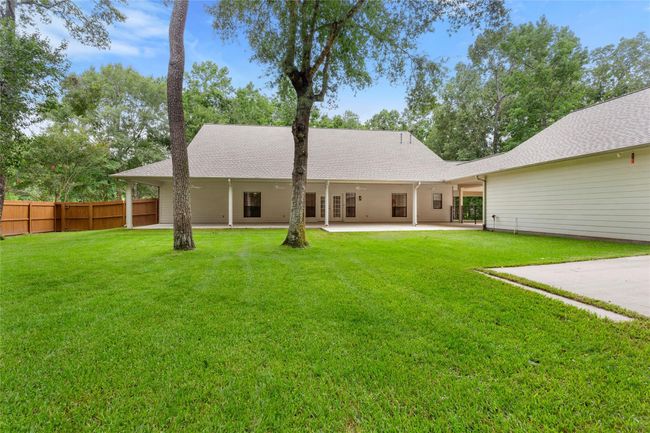 Park-Like fenced in backyard. | Image 37