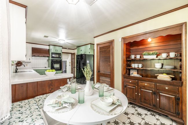 This built in space is great extra storage and a place to show off some of your fun decorative items as well. | Image 31