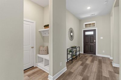 Looking towards the entryway, to the left is the laundry room & storage, perfectly situated right off the garage. | Image 3