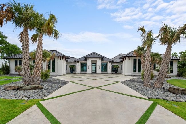 View of front of home featuring stucco siding, metal roof, and a standing seam roof | Image 37