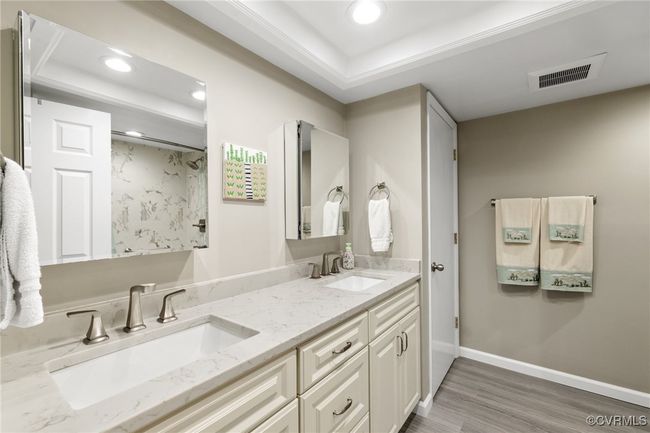 Full bathroom with wood finished floors, visible vents, recessed lighting, and a sink | Image 15