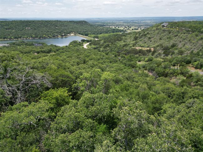 Aerial view featuring a water view and a forest view | Image 8