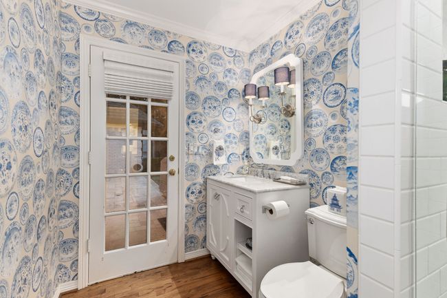 Full bath attached to laundry room with backyard access features a walk in shower | Image 31