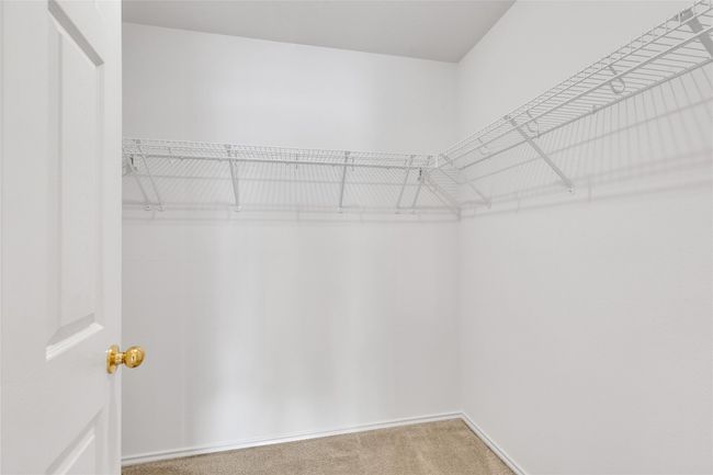 Walk in closet featuring carpet flooring | Image 19