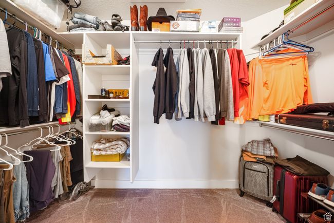 Walk in closet featuring carpet | Image 18