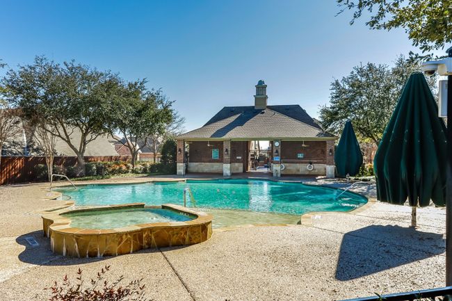 View of pool with a patio and a pool with connected hot tub | Image 30