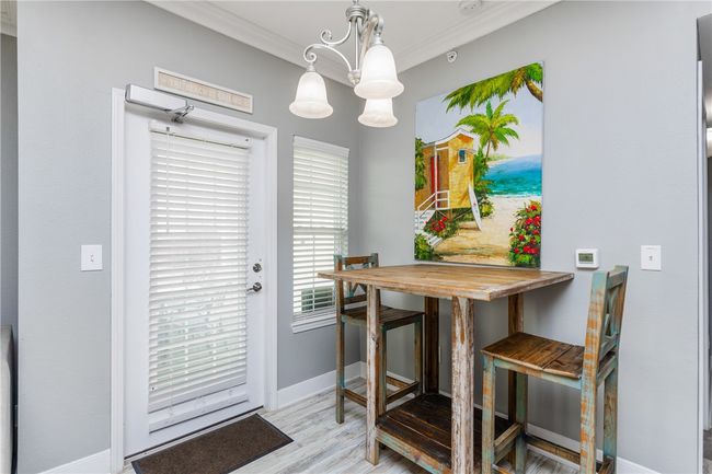 Dining area and back patio door entrance | Image 10