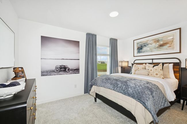 (Photo of model home, features will vary) The larger of the two secondary bedrooms, this retreat is ideal for residents who require more personal space and privacy. | Image 13