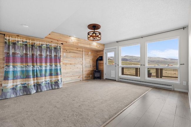 Lower level bedroom and bonus room with gas fireplace | Image 18