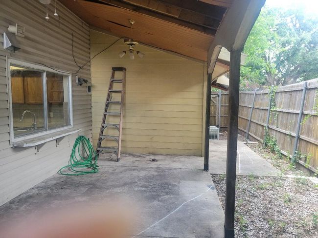 Nice size back porch with concrete | Image 13