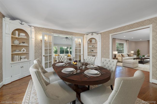 Dining area with wallpapered walls, wood finished floors, ornamental molding, and ceiling fan | Image 5