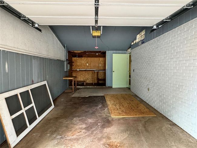 Garage featuring a garage door opener | Image 44