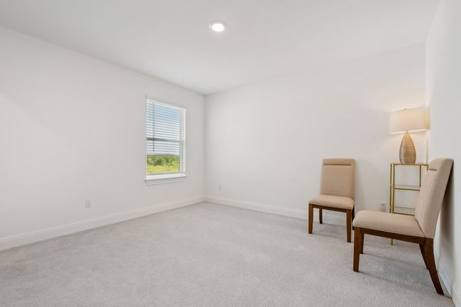 Sitting room with light colored carpet and baseboards | Image 21