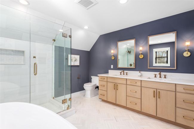 Bathroom featuring vaulted ceiling, visible vents, a sink, and a shower stall | Image 15