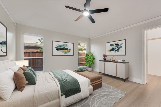 Bedroom with light wood-style flooring and a ceiling fan | Image 10