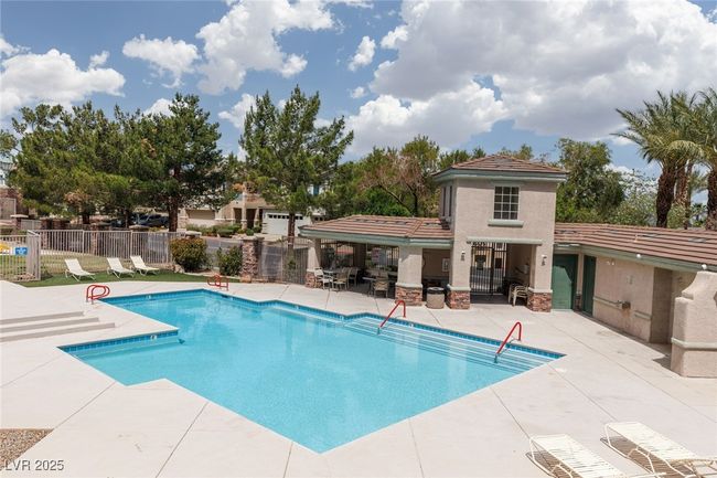 Pool with fence and a patio area | Image 30