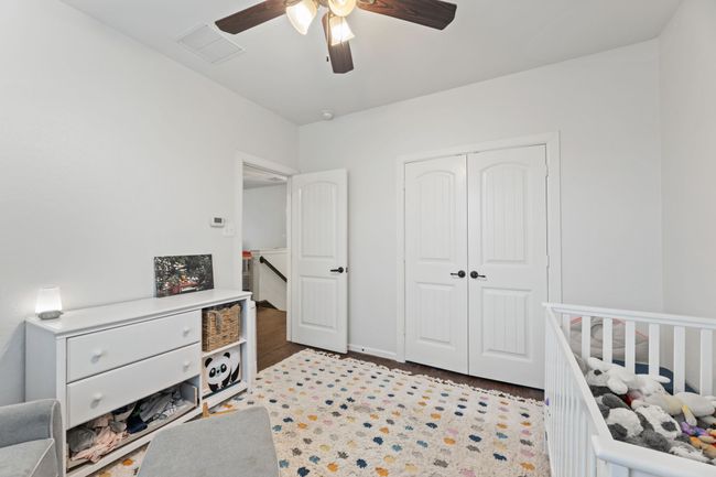Bedroom featuring a closet and ceiling fan | Image 29