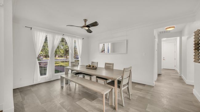 Dining room featuring crown molding and ceiling fan | Image 7