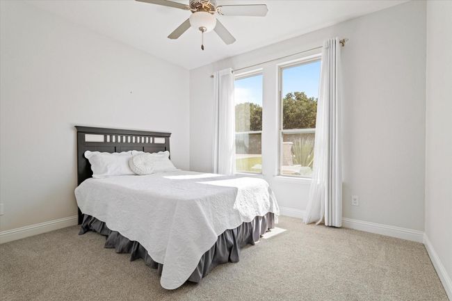Bedroom featuring carpet floors and a ceiling fan | Image 17