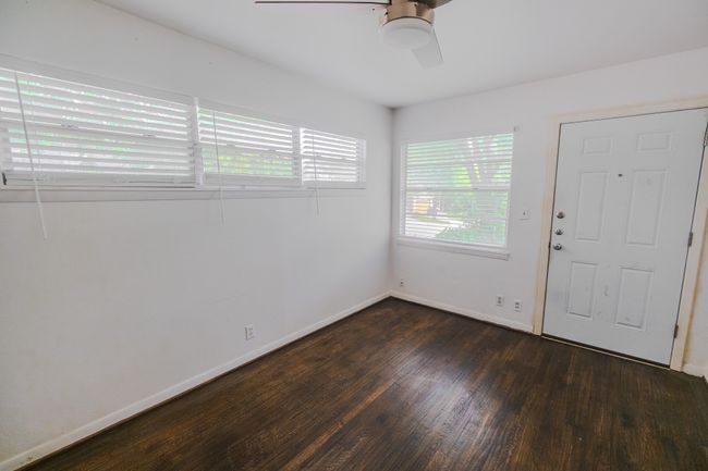 Foyer entrance with ceiling fan, dark wood-style floors, and baseboards | Image 10