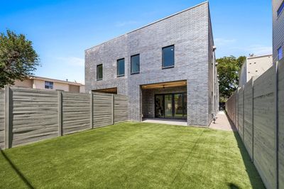 Rear view of property with a patio area and a lawn | Image 2