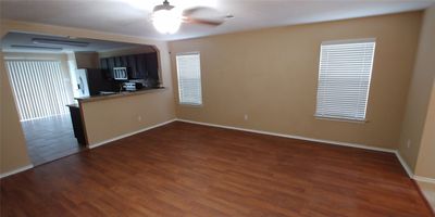 Main down stairs living area opens to the kitchen for easy entertaining and family time. | Image 3