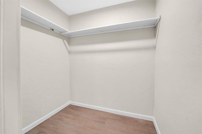 Walk in closet with hardwood / wood-style floors | Image 29