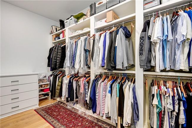 Spacious closet featuring wood finished floors | Image 37