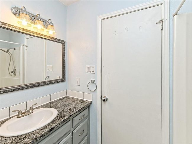 Bathroom with vanity and a shower | Image 29