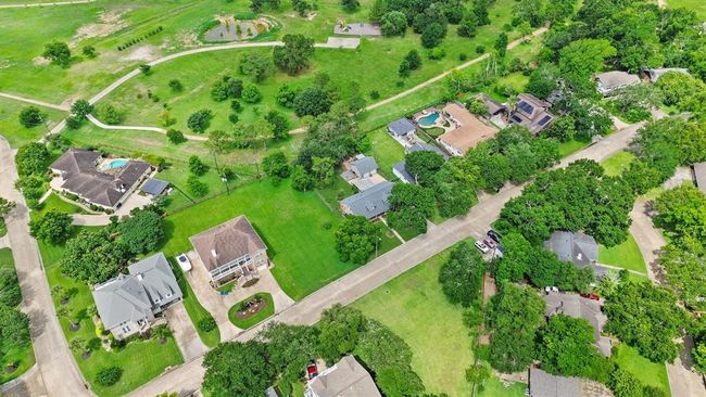 Backing to Taylor Lake Village Park with direct gate access from your backyard—enjoy a scenic walking track, frisbee golf course, open green space, and more right outside your door. | Image 27