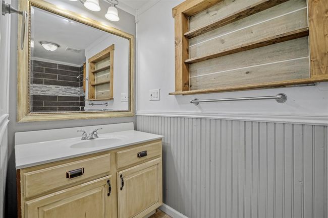 Bathroom featuring vanity and a wainscoted wall | Image 14