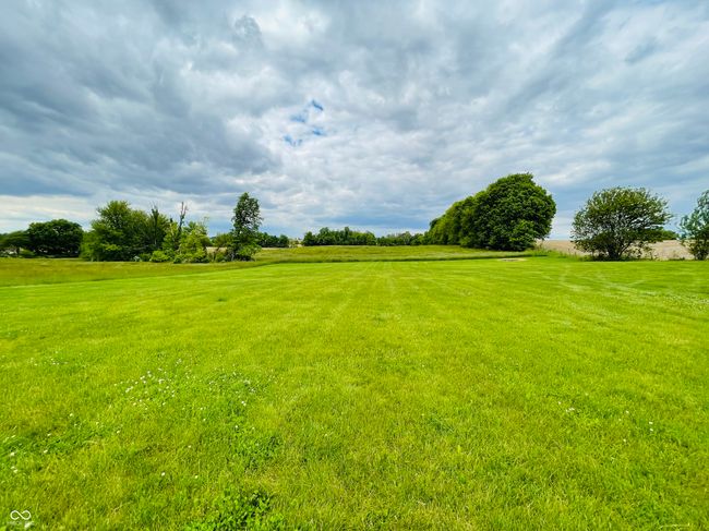 view of grassy yard with a view of countryside | Image 28