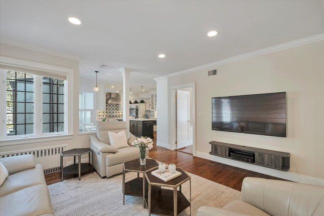 Other view of family room with wood flooring, gorgeous moldings, perfect for family and friends to gather and relax. | Image 8