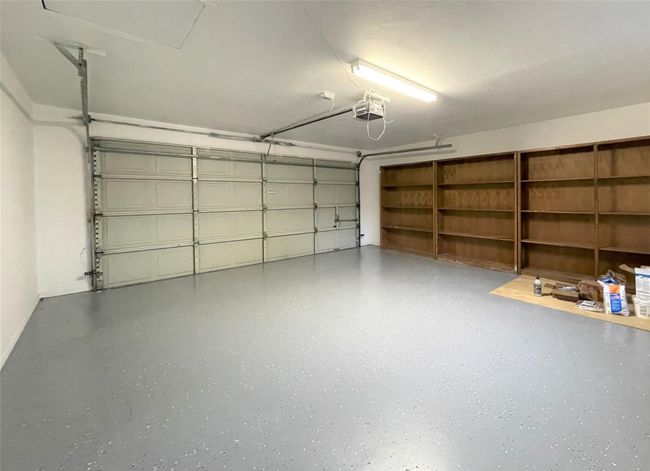 Garage with a garage door opener | Image 17